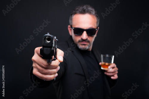 Gangster man aiming with gun