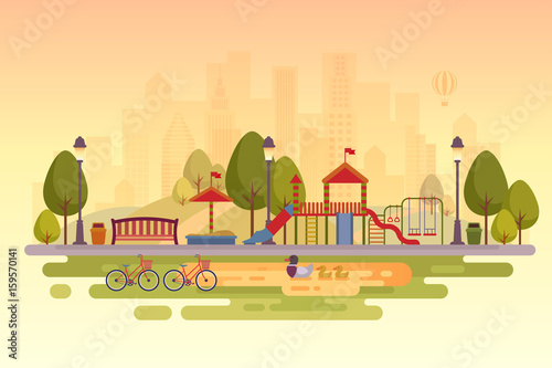 City park with playground. Sunset background.