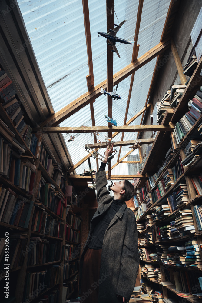 Obraz premium Fashion photo of a young woman in a big coat