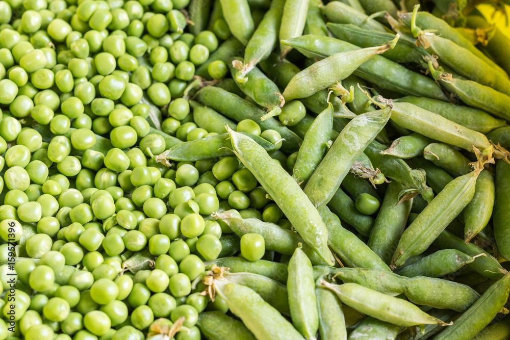 Flat lay pile of fresh green peas closeup macro Flat lay pile of fresh green peas closeup macro