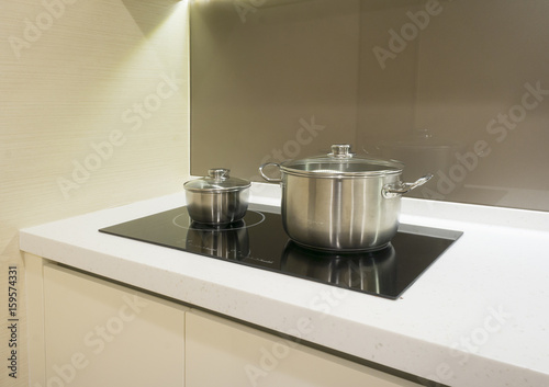 Arranged kitchen pots on stove