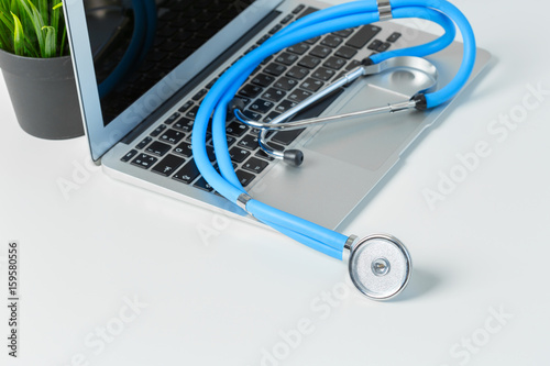 stethoscope on modern laptop computer. Healthcare concept