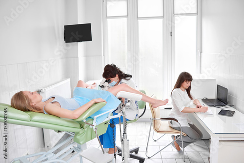 Quadro su tela Professional gynecologist working with her patient examining her healthcare medicine gynecology feminine concept