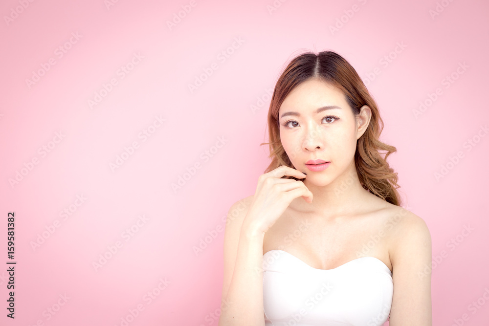 Beautiful korea woman posing with face and skin concept, isolated on pink background, 20-30 year old. Beautiful korea woman posing with face and skin concept, isolated on pink background, 20-30 year old.