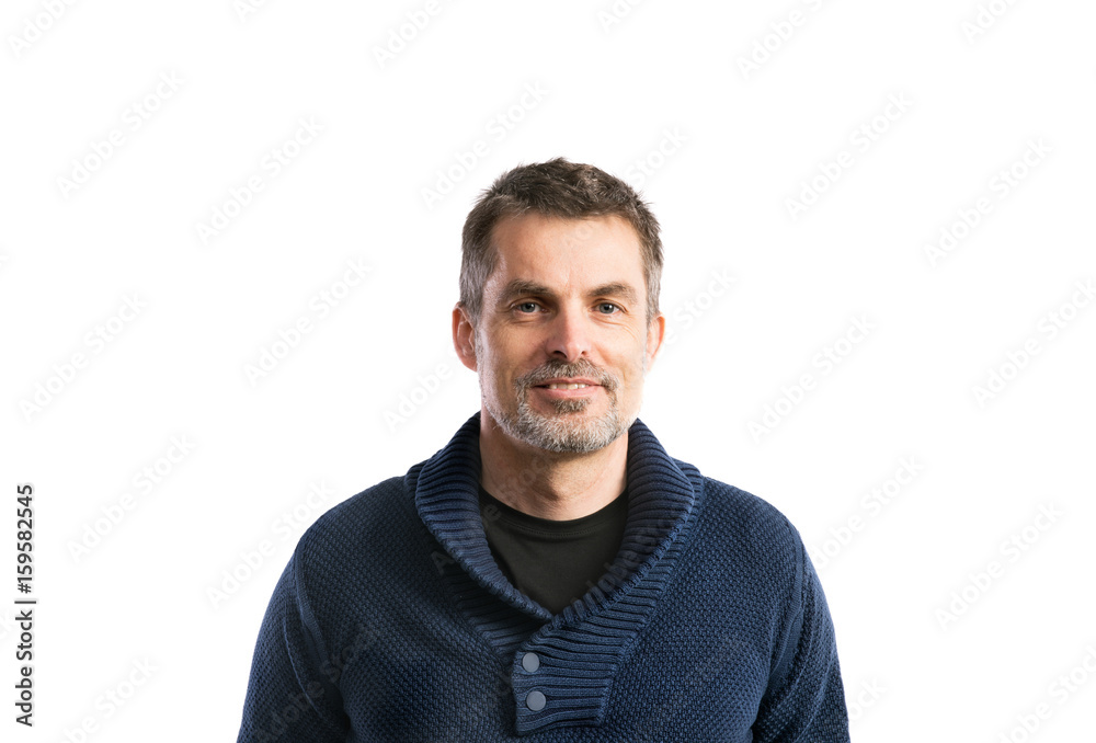 Mature hipster man in blue sweater. Studio shot, isolated. Mature hipster man in blue sweater. Studio shot, isolated.