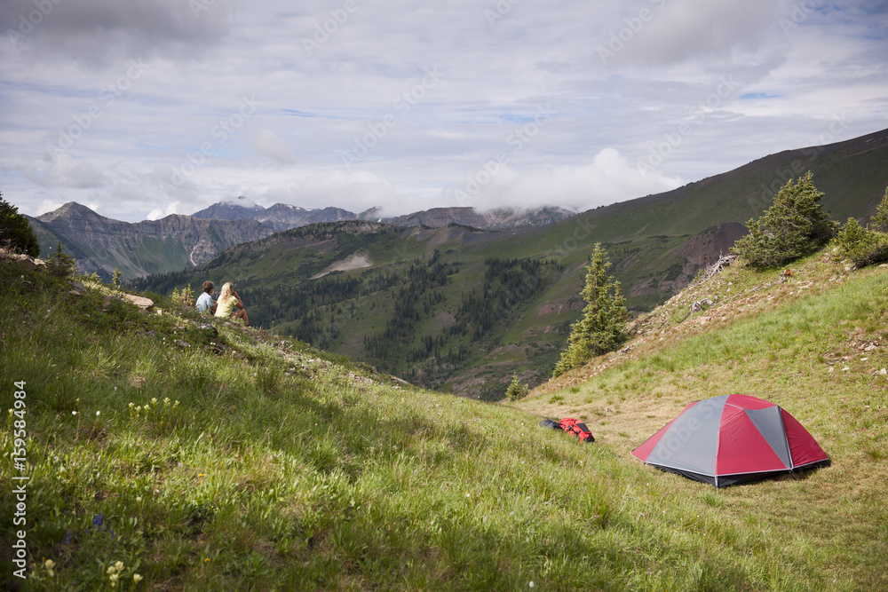 Couple camping near Paradise Divide in the West Elk Mountains, Crested Butte, Colorado, USA Couple camping near Paradise Divide in the West Elk Mountains, Crested Butte, Colorado, USA