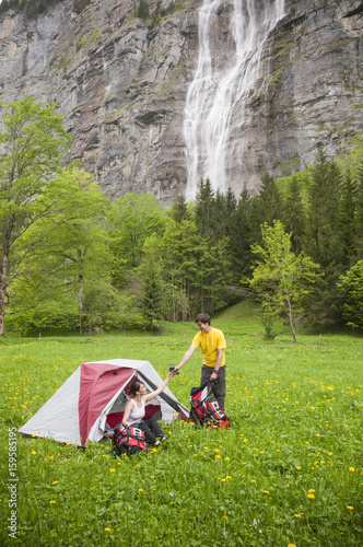 Couple camping, Stechelberg, Bernese Oberland, Switzerland photo