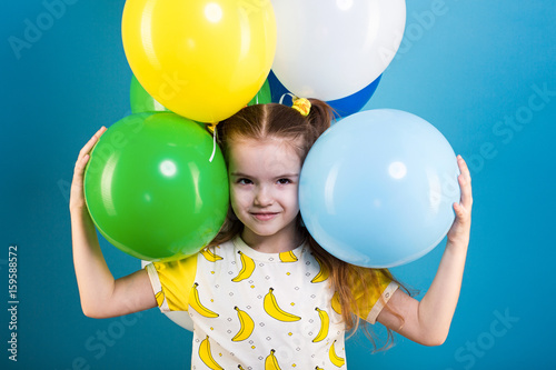 Little girl with baloons