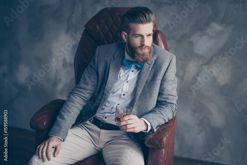 Tableau sur toile Successful young red bearded elegant businessman in suit with perfect hairstyle
