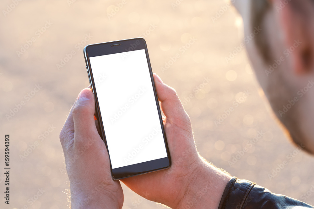 Man uses his Mobile Phone outdoor