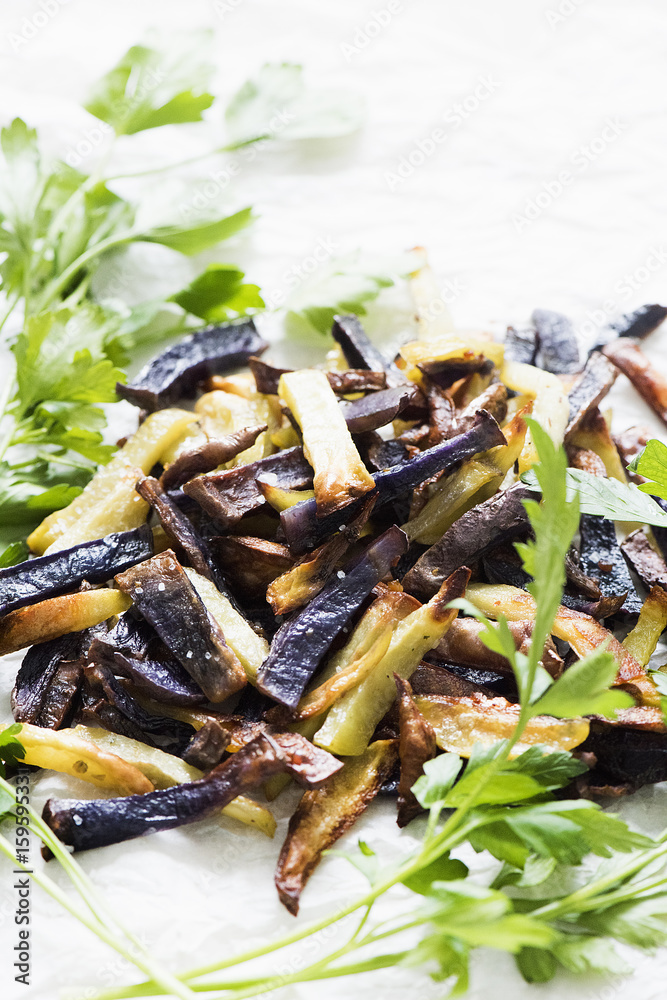 Colourful french fries with parsley, close-up Colourful french fries with parsley, close-up