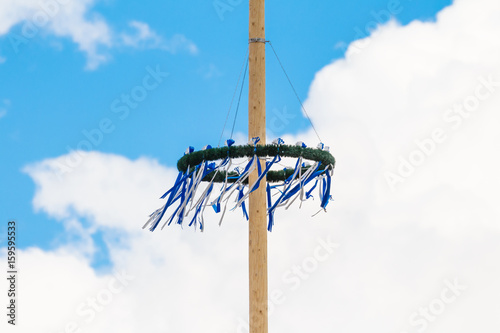wooden bavarian maypole on a sunny spring day
