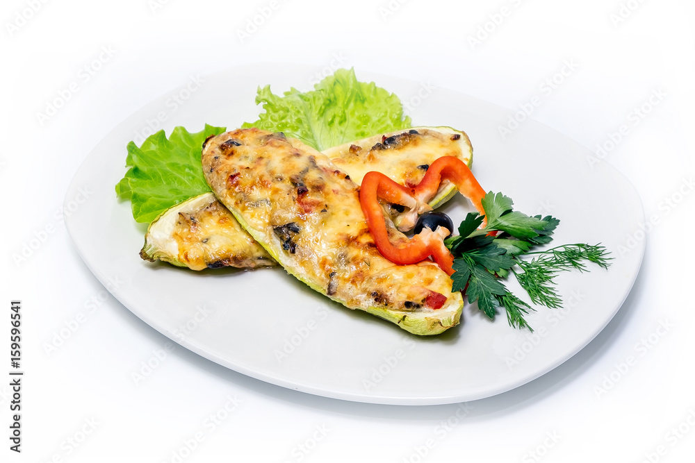 Stewed zucchini with cheese, vegetables and greens on a plate Stewed zucchini with cheese, vegetables and greens on a plate