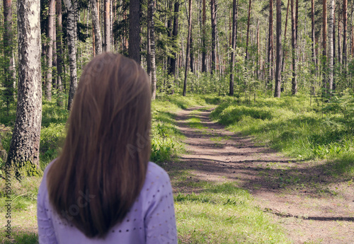 The girl is looking at a beautiful forest. Instagram