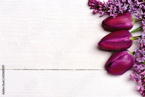 Fototapeta Naklejka Na Ścianę i Meble -  Bunch of lilac and purple tulips on white wooden surface
