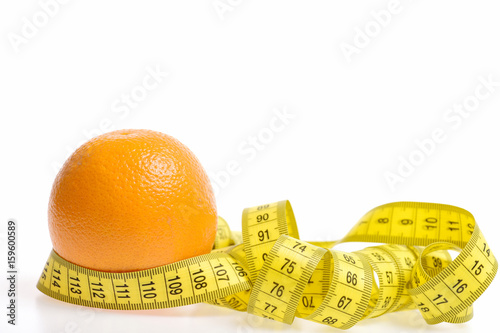 Orange curled around with yellow measuring tape