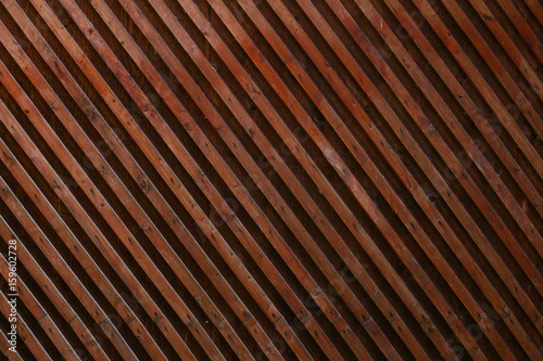 Faded wooden planked grid fence texture background. Vintage effect.