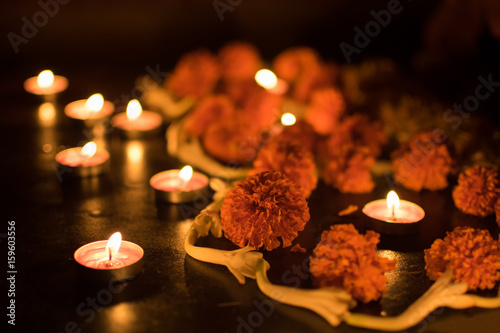 Deepabali - colourful candles are lit in darkness photo