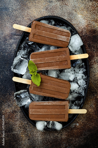 Vegan banana chocolate mint fudge popsicles. Homemade creamy dairy free ice pops, nicecream, fudgesicles photo