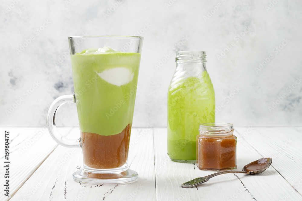 Matcha latte with salted caramel in tall glass. Matcha latte with salted caramel in tall glass.