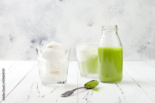 Preparing matcha green tea affogato with vegan coconut ice cream. Copy space