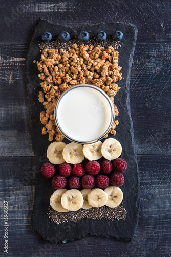 Healthy breakfast concept with grains, berry fruits,chia seeds and banans photo