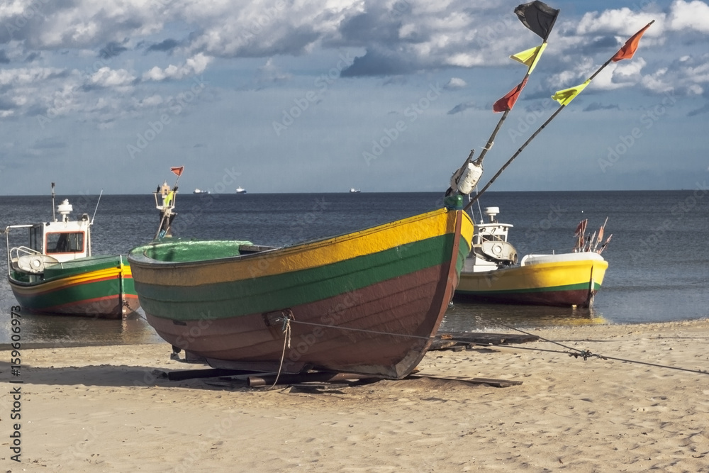 Fototapeta premium Three fisherman boats at sunny day on the beach