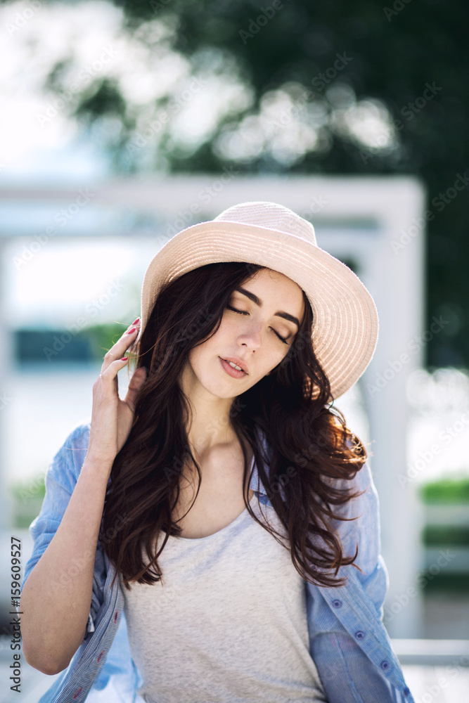 Close up portrait of an beautiful woman wearing sun hat