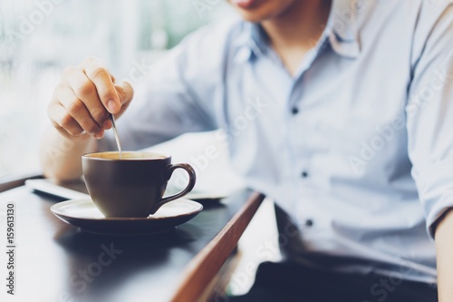 Man Drinking coffee in the coffee shop and relaxing.