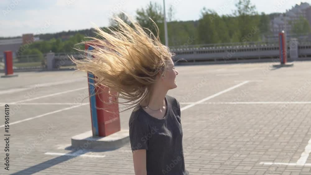 Young beautiful woman enjoying time on a rooftop Young beautiful woman enjoying time on a rooftop