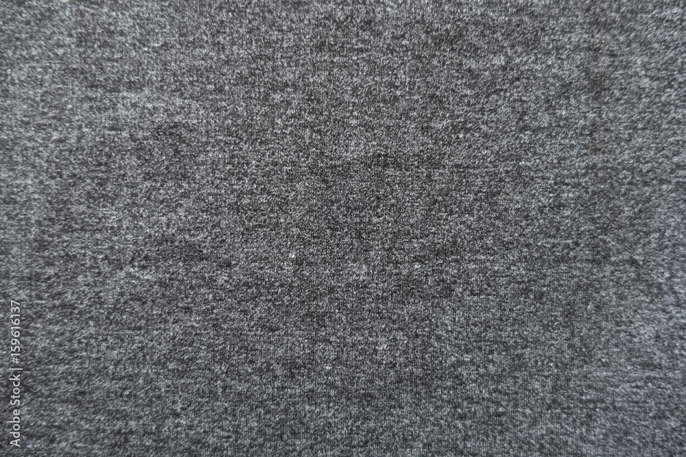Fototapeta premium Plain dark grey jersey fabric from above