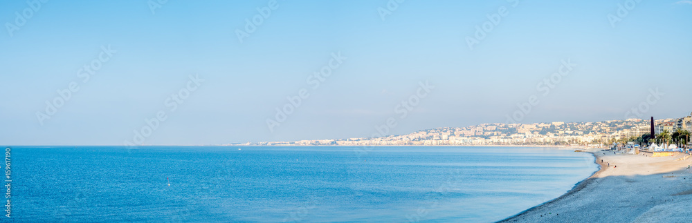 Obraz premium Coast line along Mediterranean sea in Nice, favorite vacation city in France, under morning sunlight