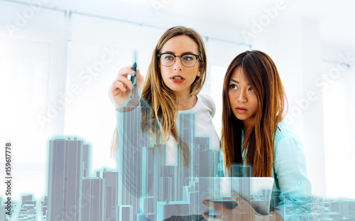 Free Download Two women designing skyscrapper with augmented reality tool - GFXLoad
