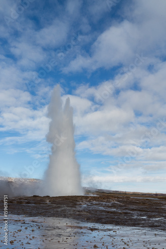 Geysir geyser erupting in a tower of spray in Iceland.
