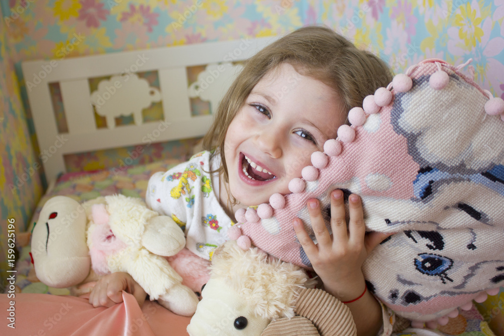 Little girl in bed hugging no-name teddy bear Little girl in bed hugging no-name teddy bear
