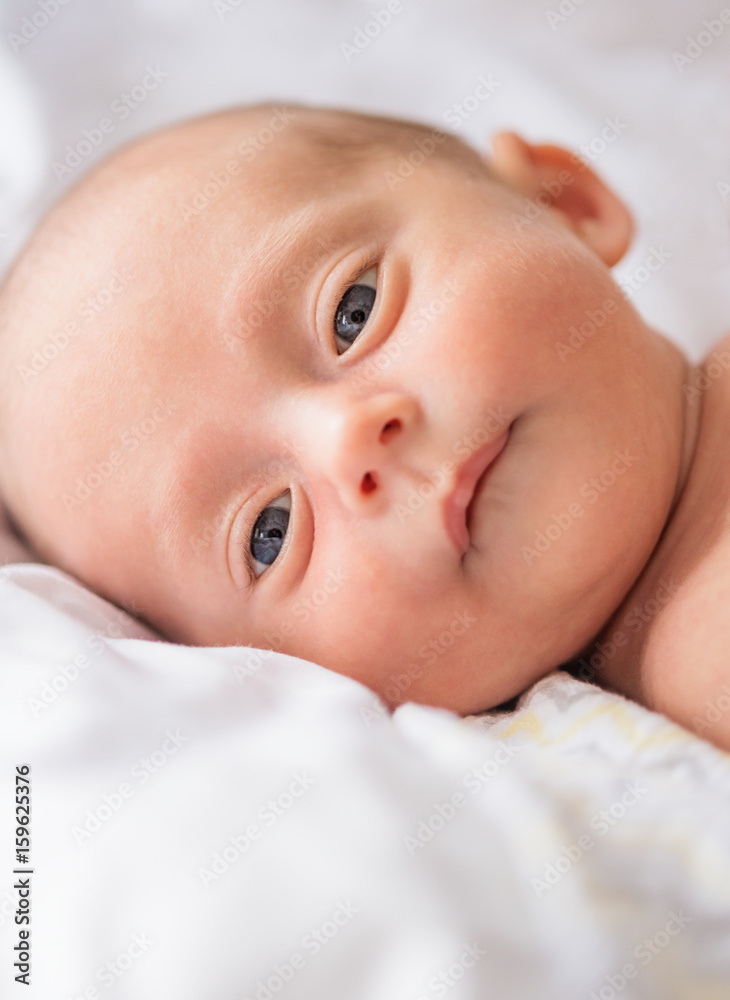 Baby boy (0-1 months) lying on bed Baby boy (0-1 months) lying on bed