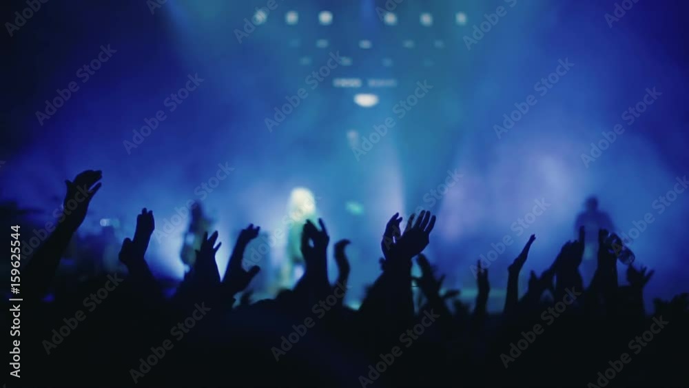 Iconic night rock concert front row crowd cheering hands in air slomo 100p Iconic night rock concert front row crowd cheering hands in air slomo 100p