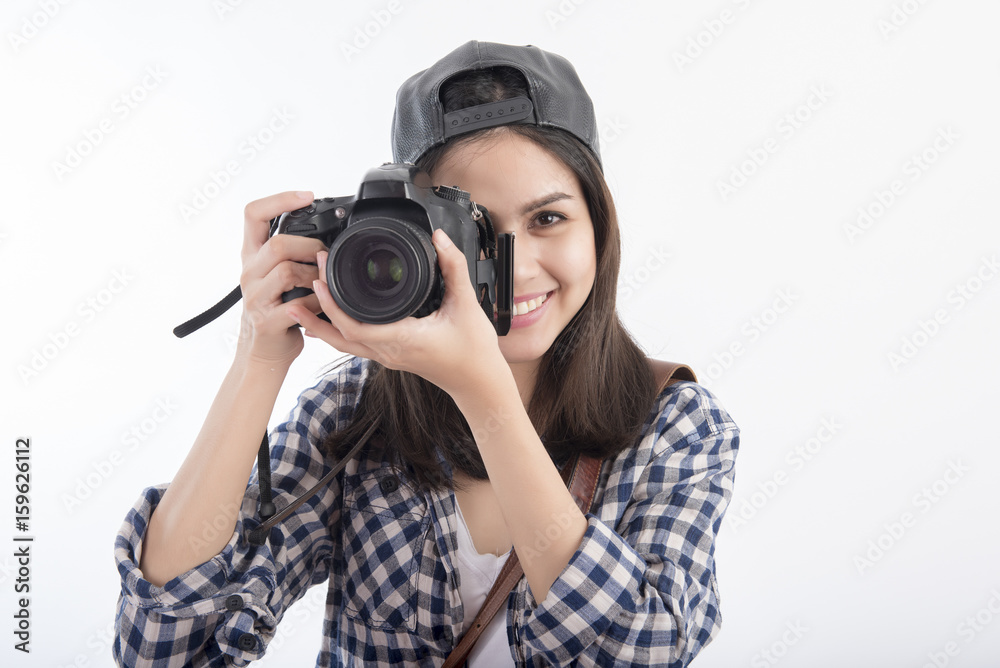 Beautiful travel girl with camera isolated on white background Beautiful travel girl with camera isolated on white background