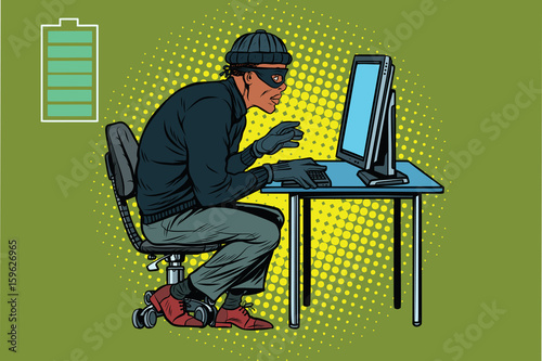 African hacker thief hacking into a computer
