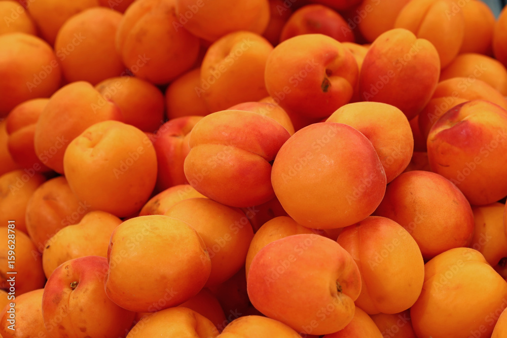 Fresh ripe apricots on retail market close up