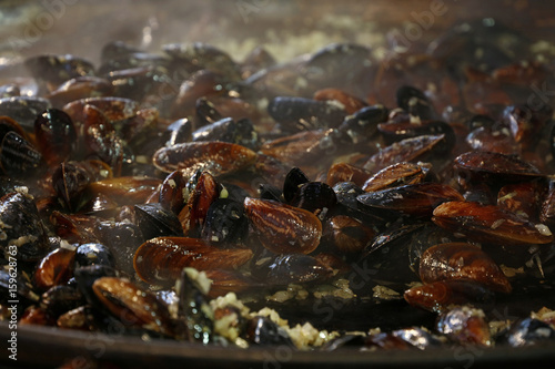 Fototapeta Naklejka Na Ścianę i Meble -  Cooking steamed roasted mussels close up