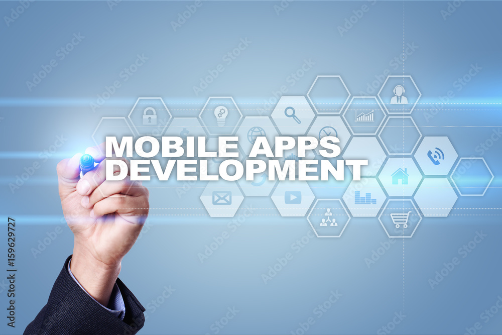 Businessman drawing on virtual screen. mobile apps development concept. Businessman drawing on virtual screen. mobile apps development concept.