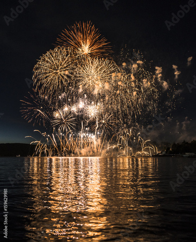 Spectacular fireworks over lake photo