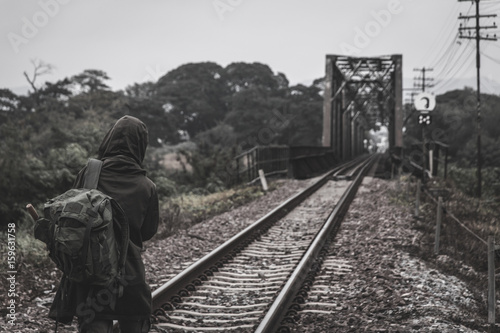 A survivor walking along a railway post apocalypse concept