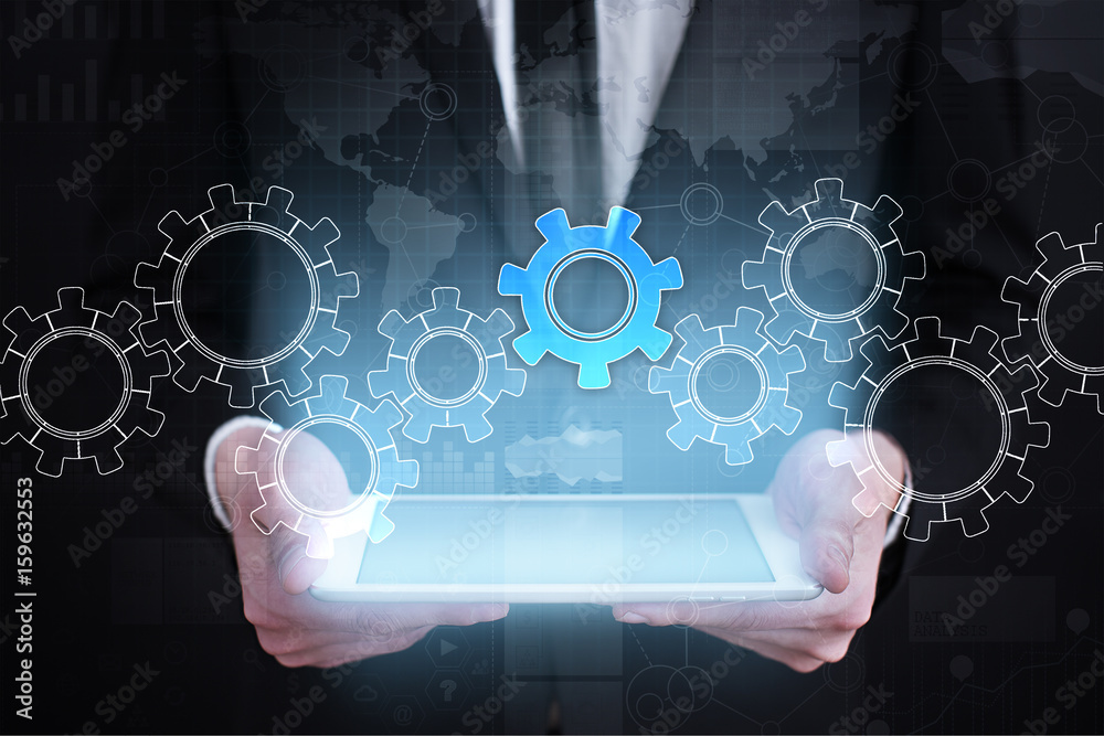 Gears on virtual screen. Business strategy and technology concept. Gears on virtual screen. Business strategy and technology concept.