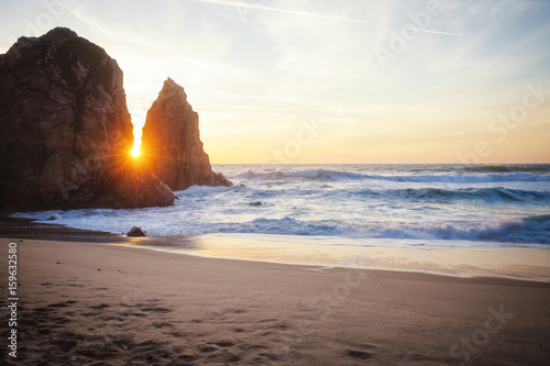  Beautiful rocky cliff beach at sunset