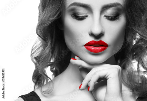 Young woman with red lips on white background