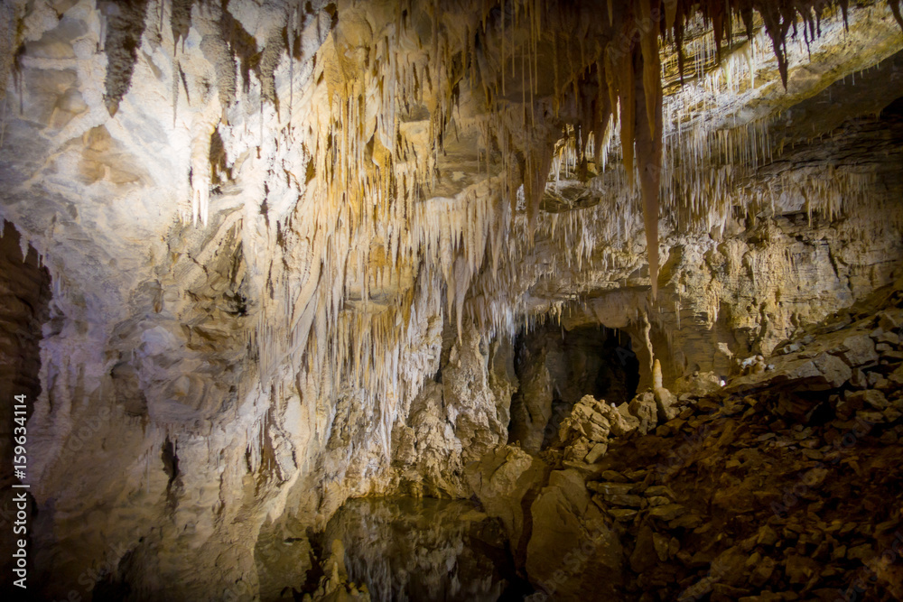 Stalagmites and stalactites in Ruakuri Cave, Waitomo in New Zealand Stalagmites and stalactites in Ruakuri Cave, Waitomo in New Zealand