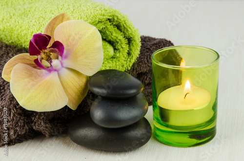 spa concept with lava stones, orchid and candle