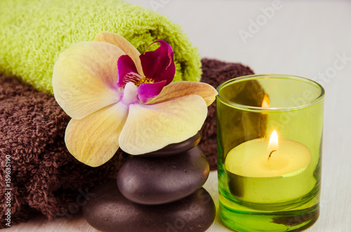 spa concept with lava stones, orchid and candle